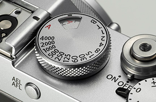 El dial de control de la velocidad de exposición en una cámara reflex.